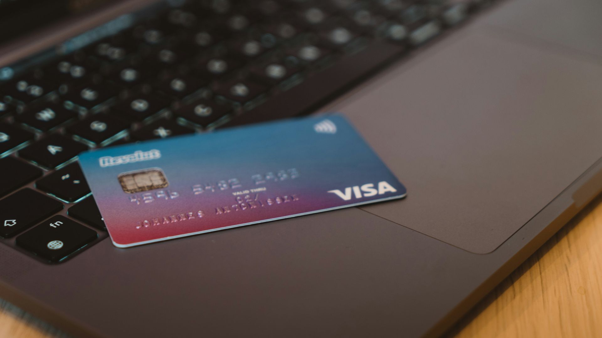 blue and white visa card on silver laptop computer