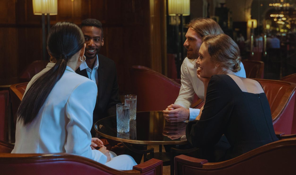 A Group of People Sitting inside a Restaurant