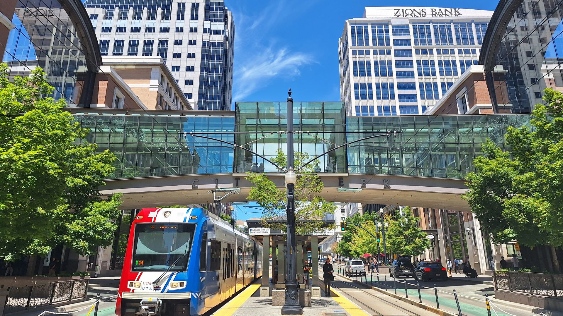 A UTA TRAX train passes beneath City Creek Center's skybridge in downtown Salt Lake City, Utah, United States. Photo taken from the platform at City Center Station.