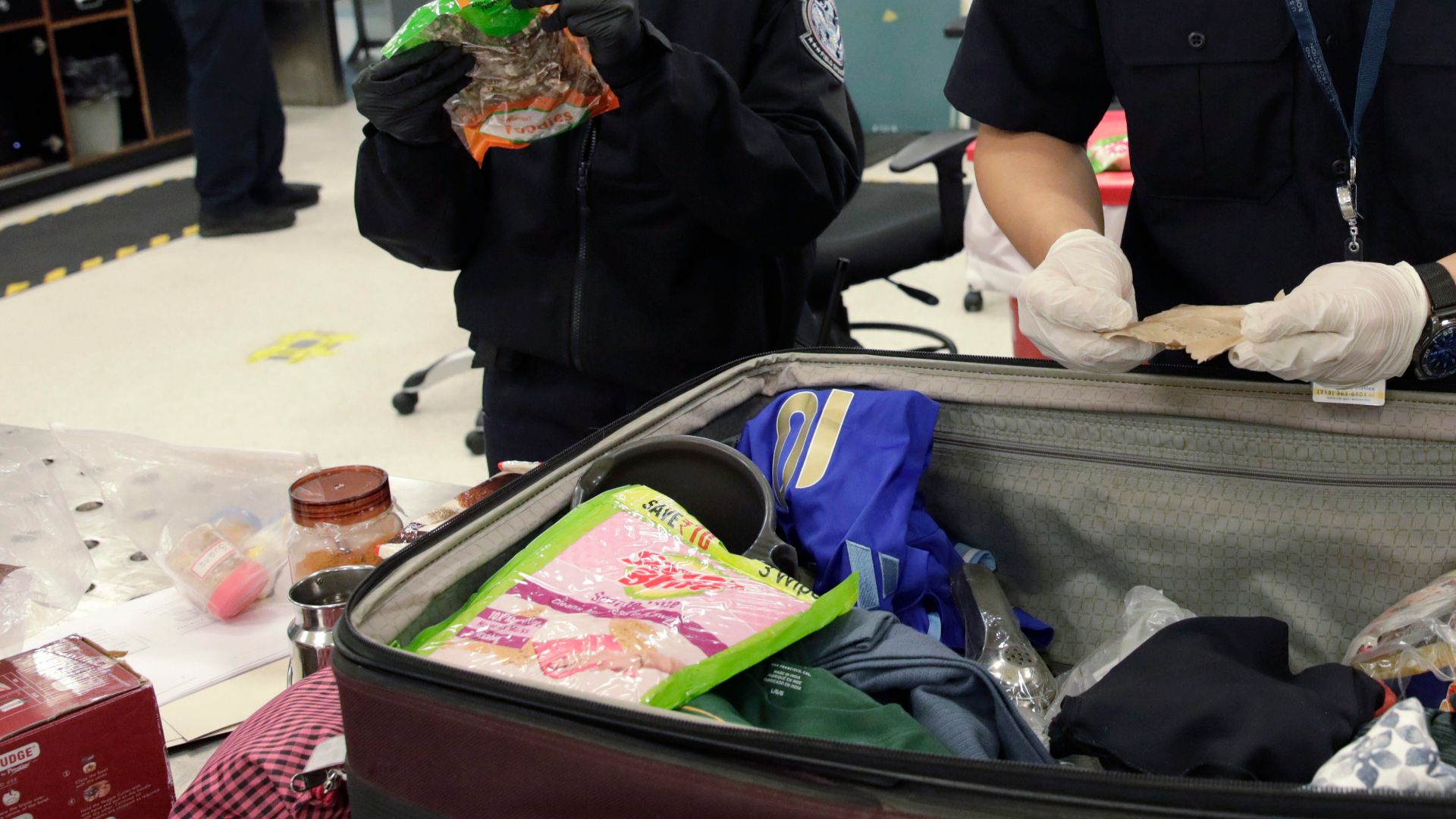 U.S. Customs and Border Protection agriculture specialists search luggage of arriving international passengers for prohibited agriculture products at Philadelphia International Airport in Philadelphia, Pa., July 29, 2024. CBP Photo by Glenn Fawcett
NOTE: Minimal blurring applied to protect PII