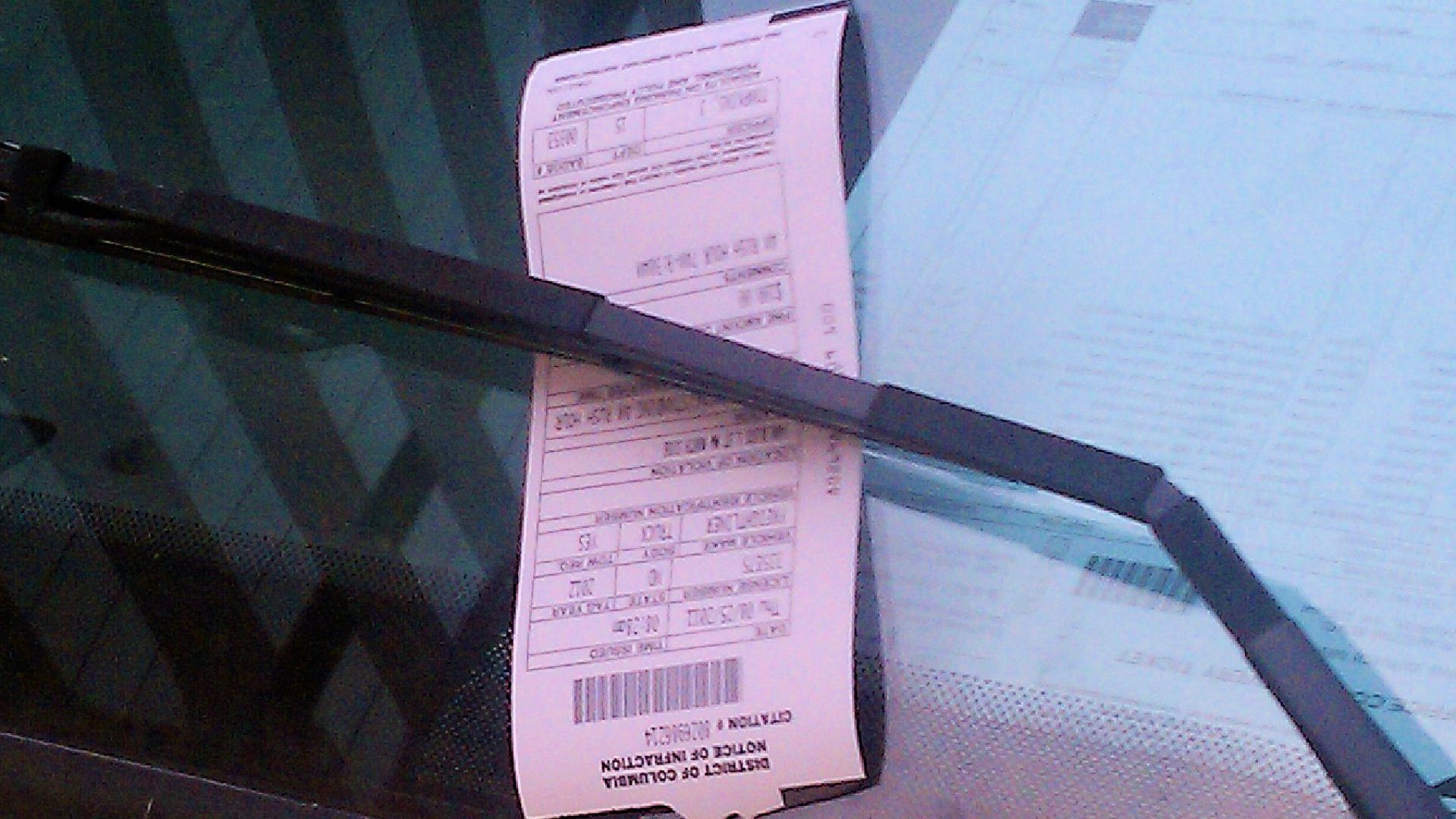 Parking ticket on the window of a commercial vehicle illegally parked in Washington, D.C., in the United States.