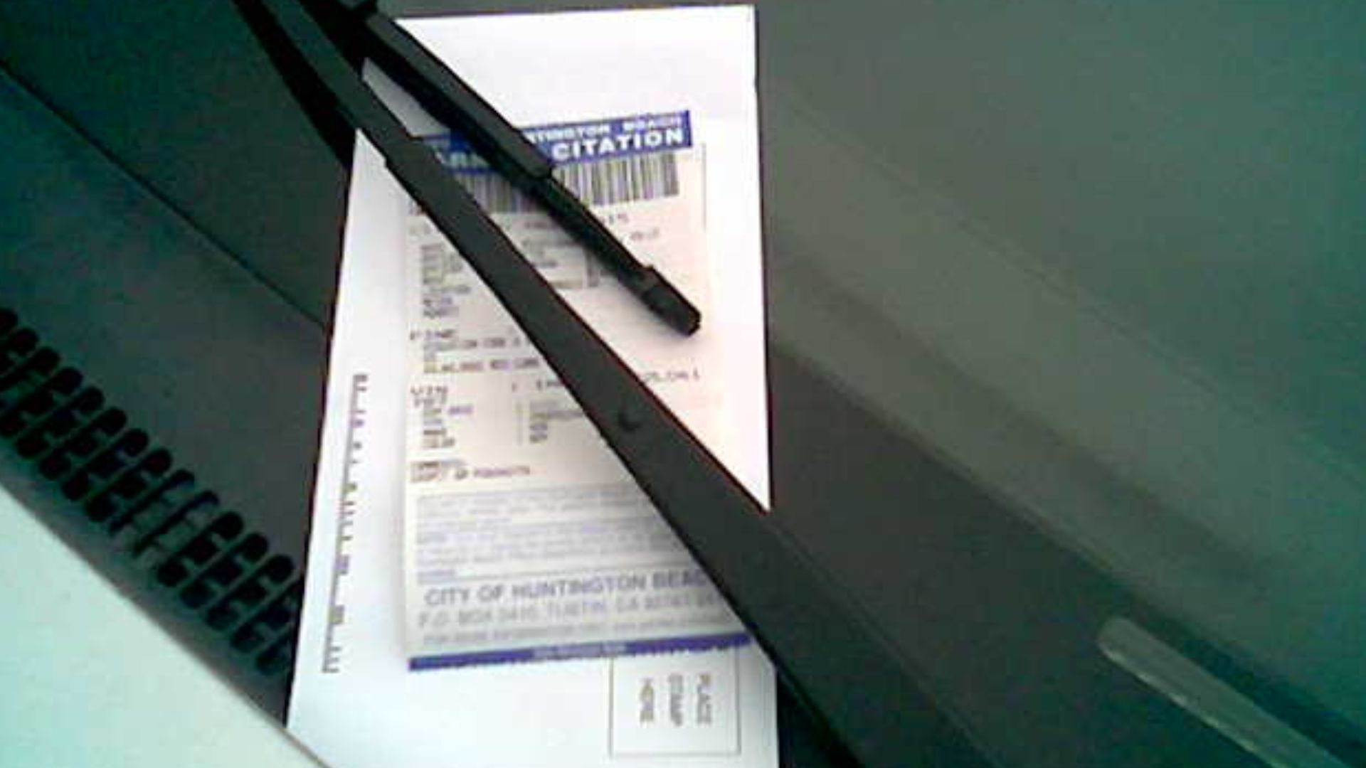 Parking citation placement (under windshield wiper) in Huntington Beach, CA.