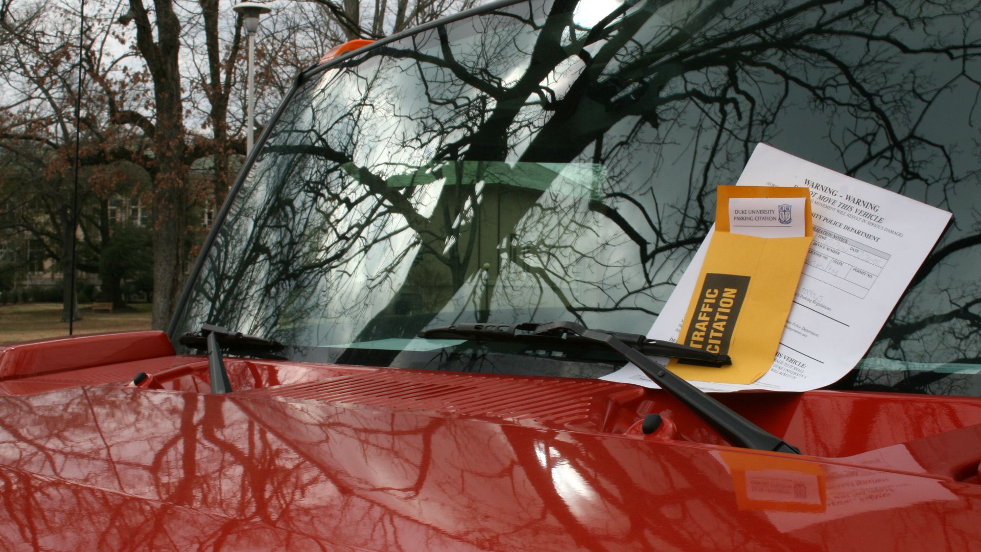 A red Hummer with a parking ticket at Duke University East Campus in Durham, North Carolina.