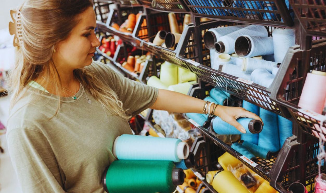 People in Store with Colorful Threads