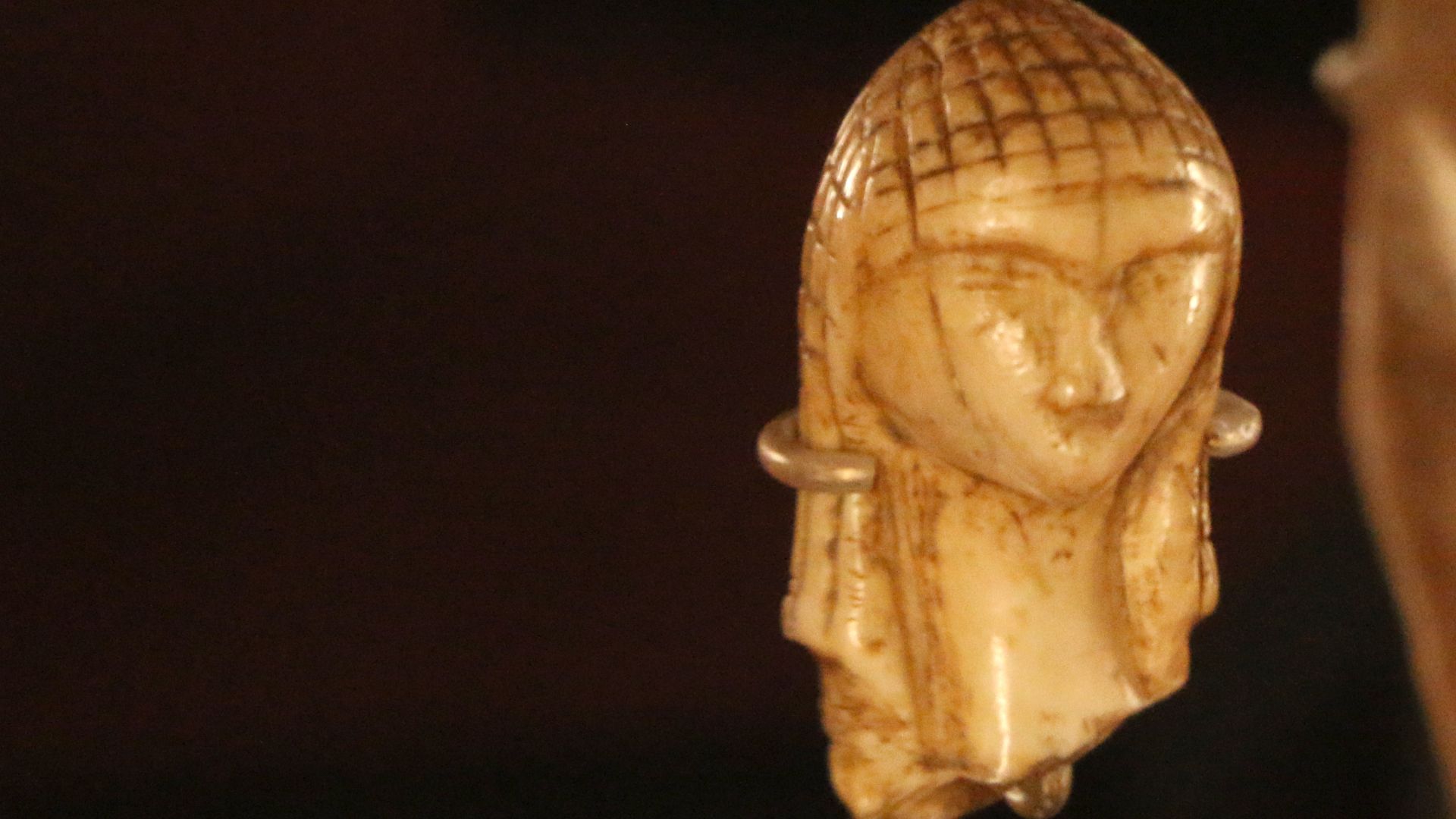 From the National Archaeological Museum of Saint-Germain-en-Laye near Paris France - The lady with the hood - mammoth ivory- behind her is the figurine with the belt - Prehistoric station of Brassempouy