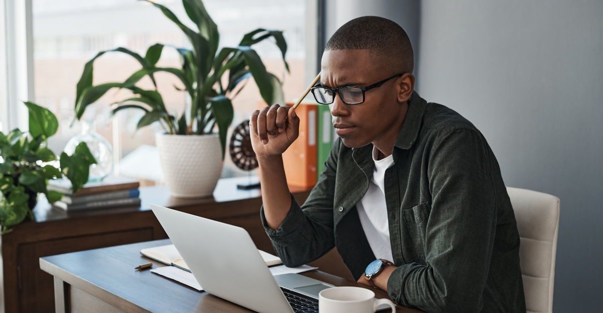 Laptop, idea and black man with doubt