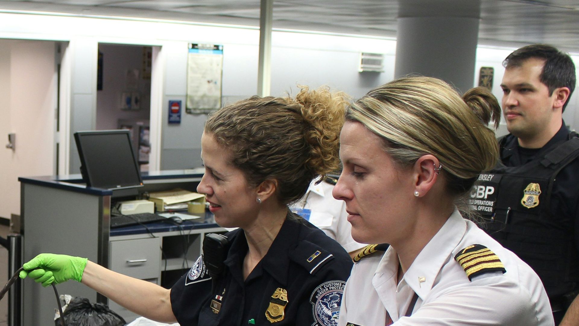 woman in black crew neck t-shirt standing beside woman in white t-shirt