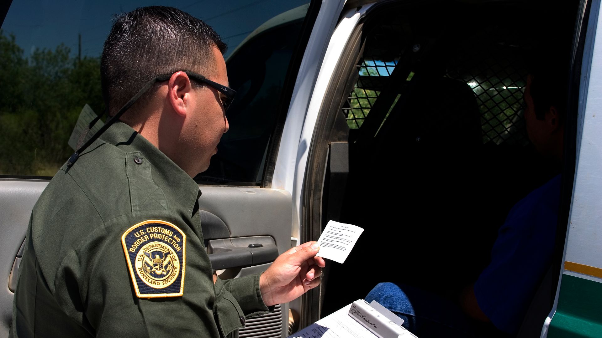 Border Patrol agent reads the Miranda rights to a Mexican national arrested for transporting drugs (U.S. Customs and Border Protection - United States Department of Homeland Security)