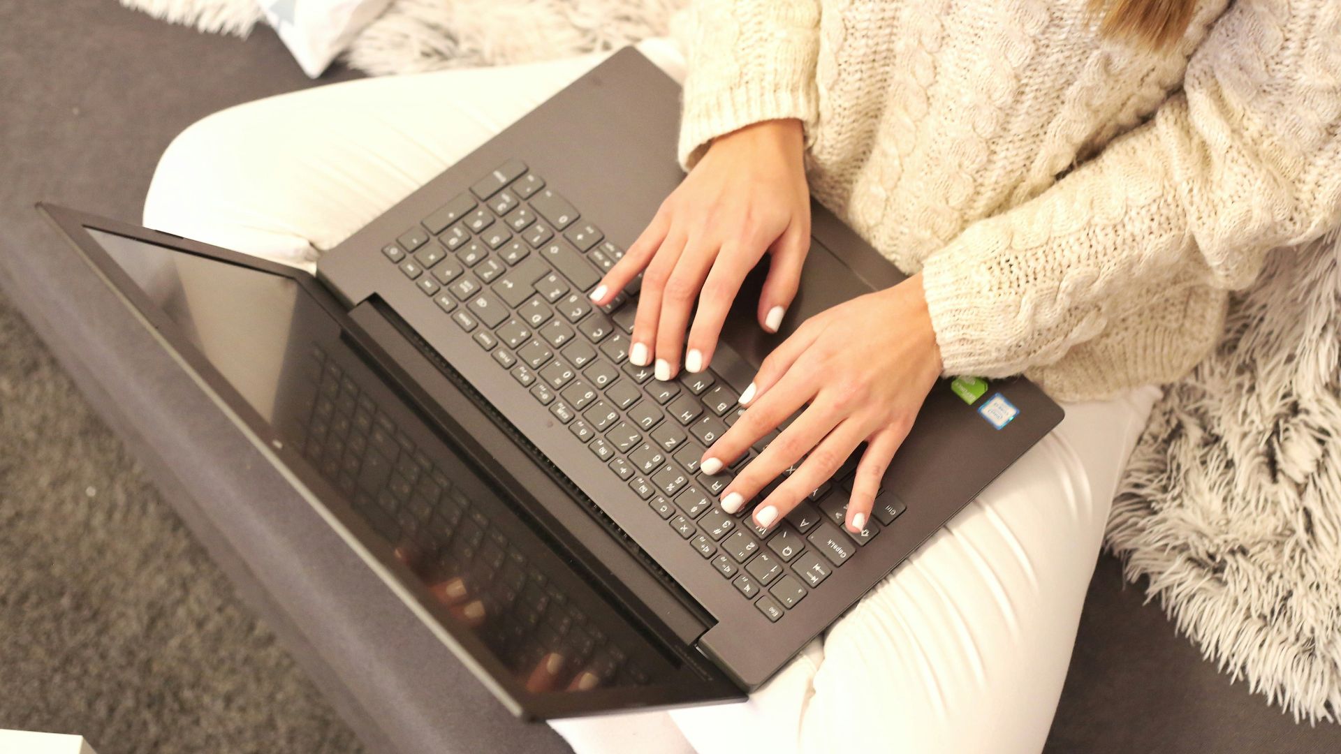 a person typing on a laptop