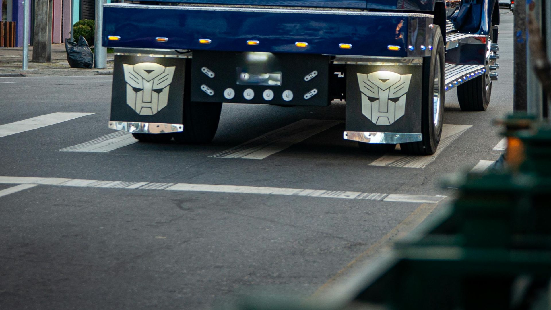 A striking customized blue pickup truck navigating a busy street in urban Brazil, showcasing unique modifications.