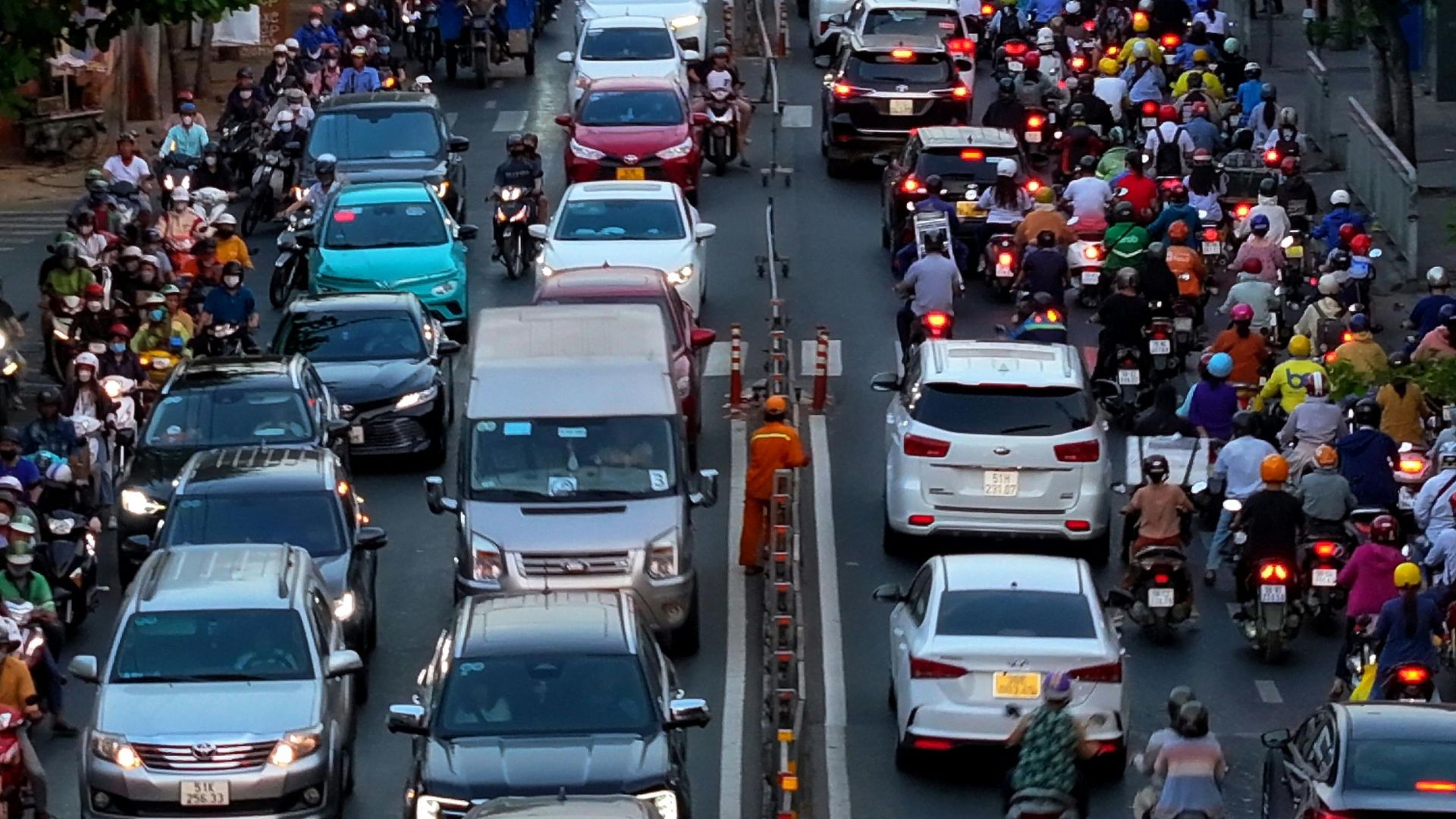Aerial view of a crowded traffic jam with cars and motorcycles in Ho Chi Minh City, Vietnam.