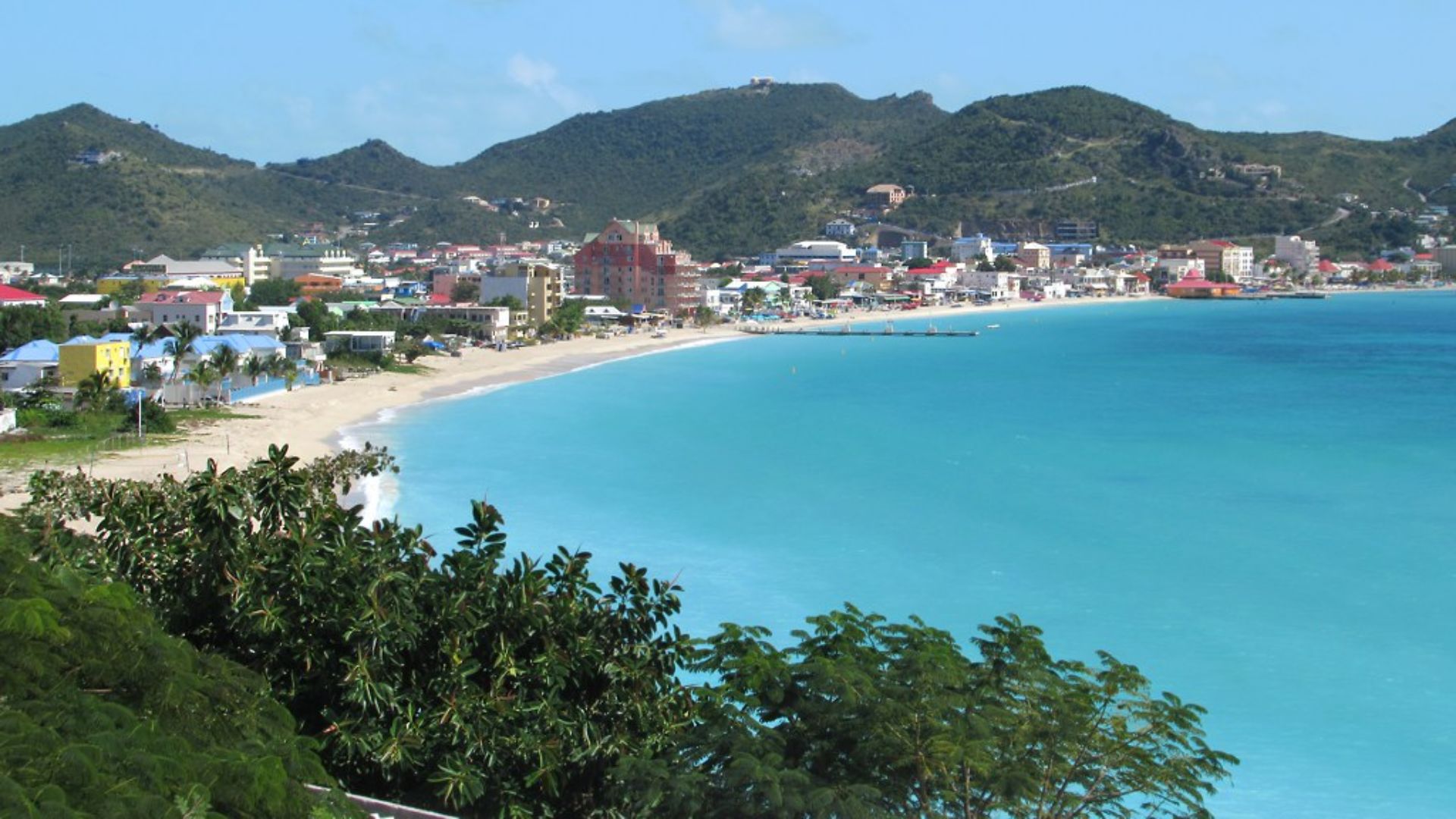 A wide white Great Bay beach marks the waterfront at Philipsburg, Sint Maarten, Eastern Caribbean.