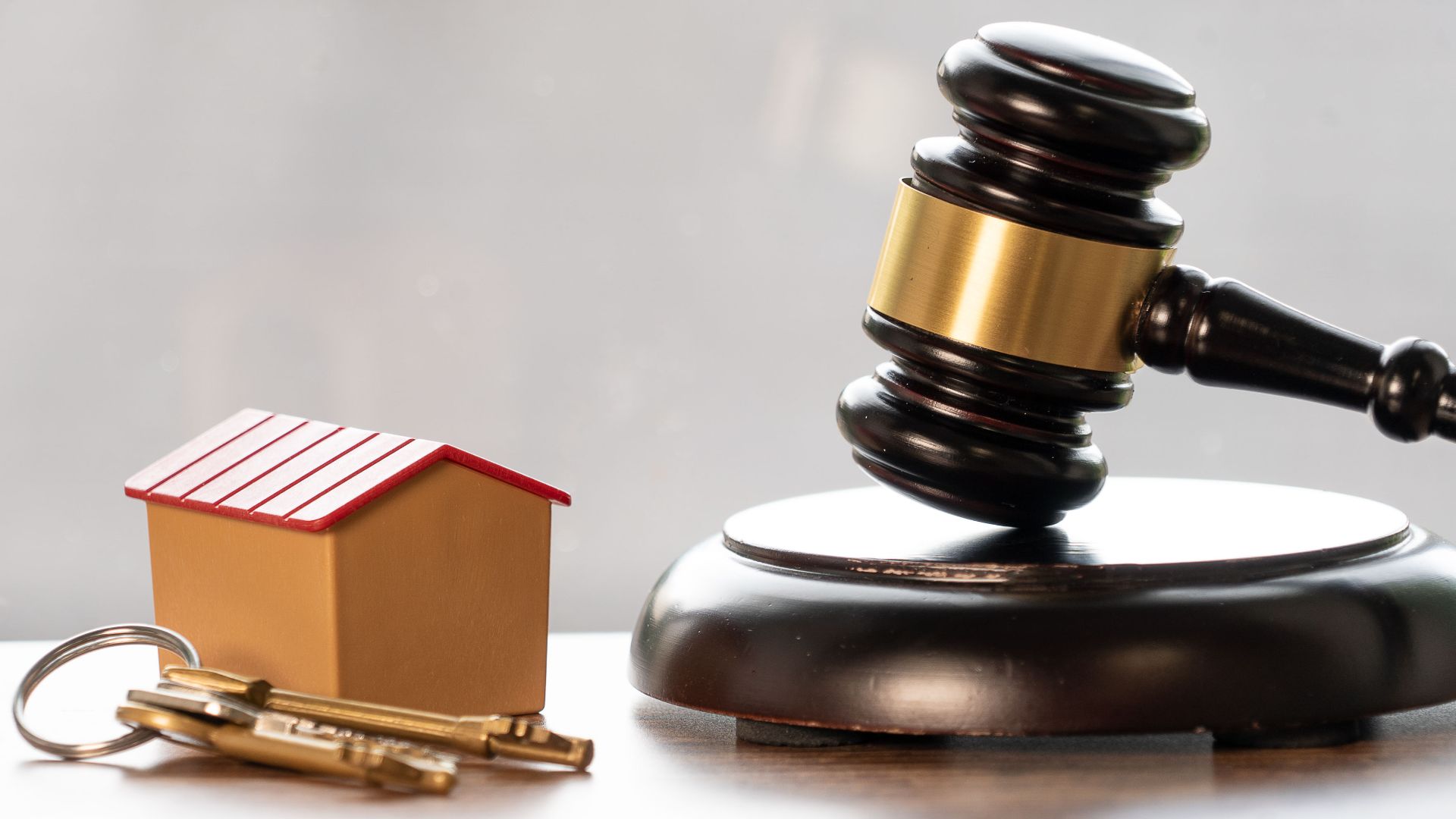 In this photo depicting property law and the process of buying a house, a gavel and block can be seen alongside a set of keys and house. We originally created this image for our own use, but have since decided to release it under Creative Commons Attribution Licensing. This means you have our full permission to use it in any way you wish. All we ask is that you kindly credit us when you do so - in the form of a link to our website: www.advokatsmart.no