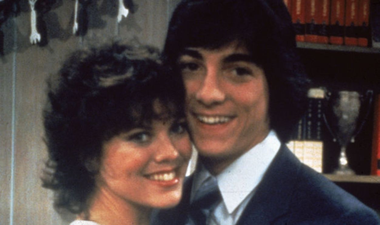  52514625 - American actors Erin Moran and Scott Baio hold each other in a publicity still for the television show 'Joanie Loves Chachi,' in which they play the title characters, 1982. 