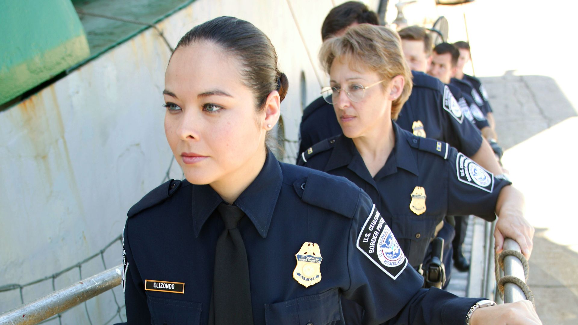 U.S. Customs and Border Protection (CBP) officers going aboard a ship to examine cargo in May 2004.