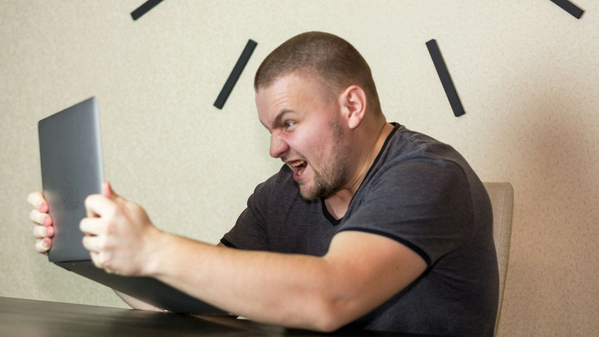 a man sitting in front of a laptop computer