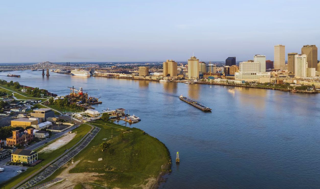 a river running through a city next to tall buildings