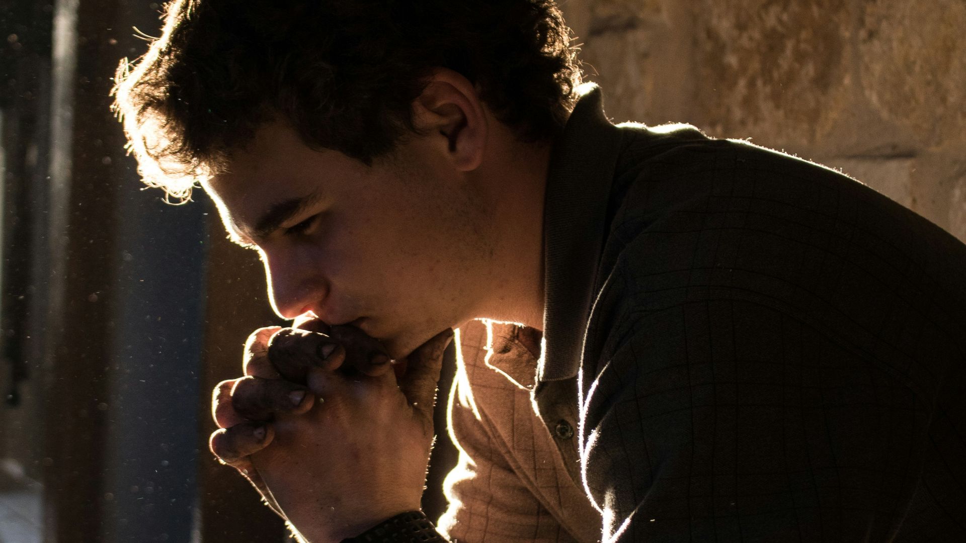 man sitting on bench