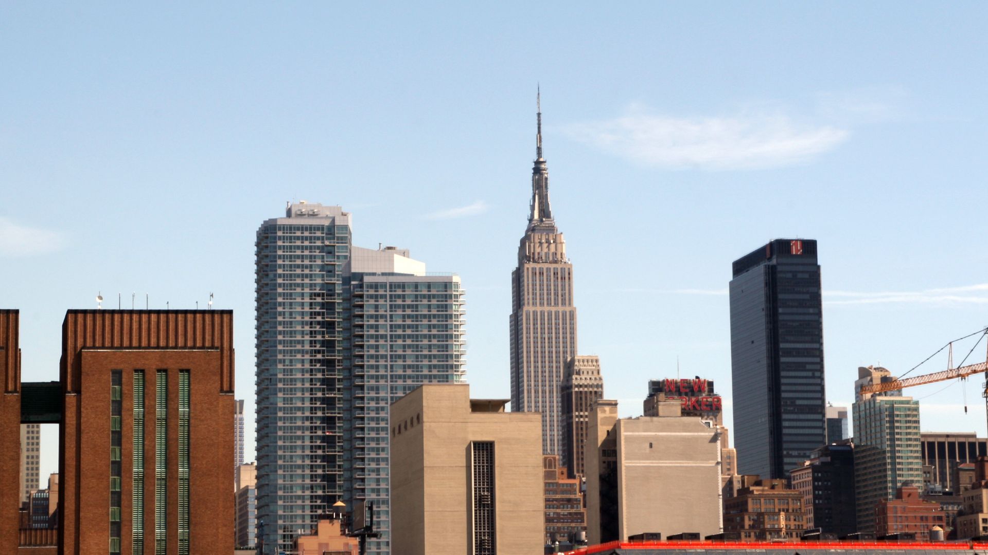 A portion of the Manhattan skyline, with the Empire State Building right in the center of the photo.