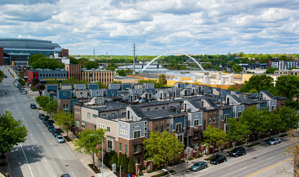 cars parked on roadside near buildings during daytime