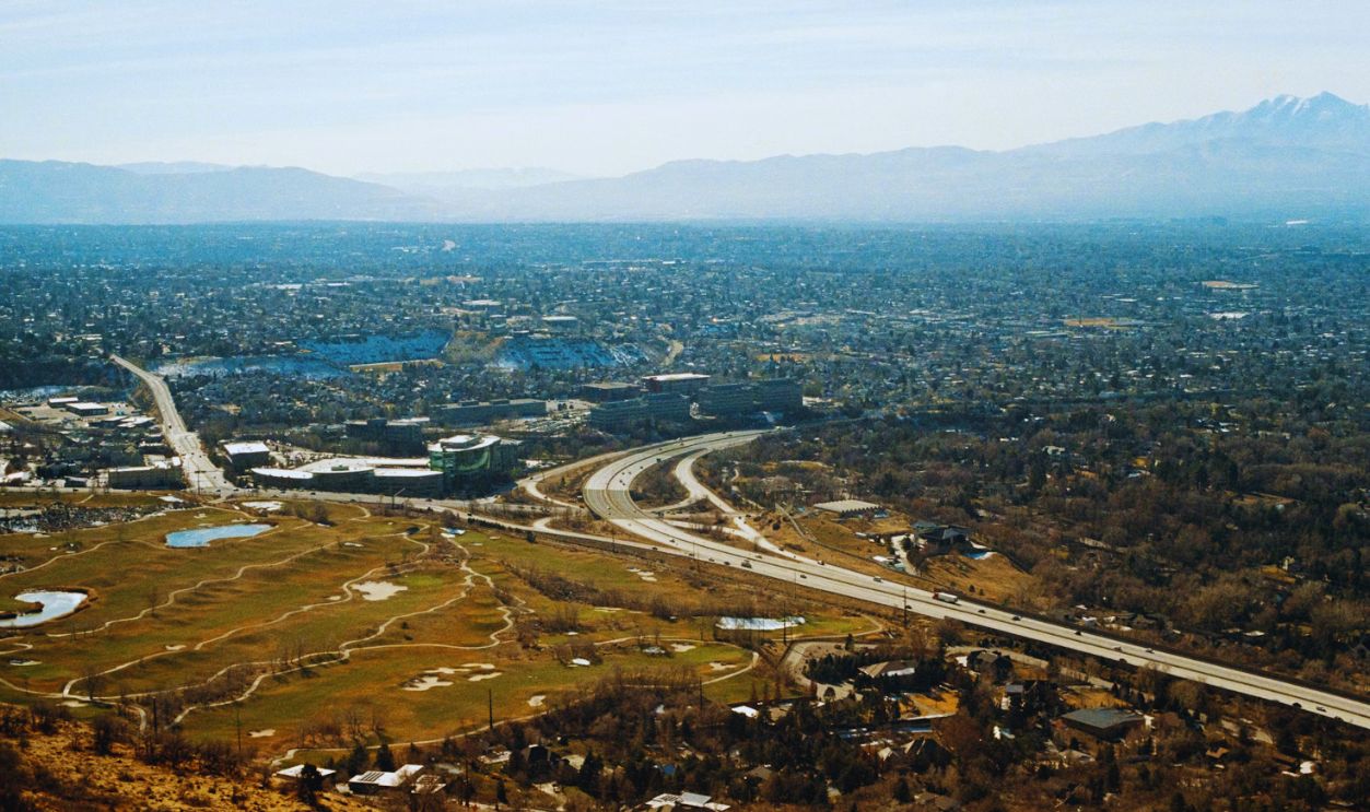 Aerial view of a sprawling city with mountains in distance