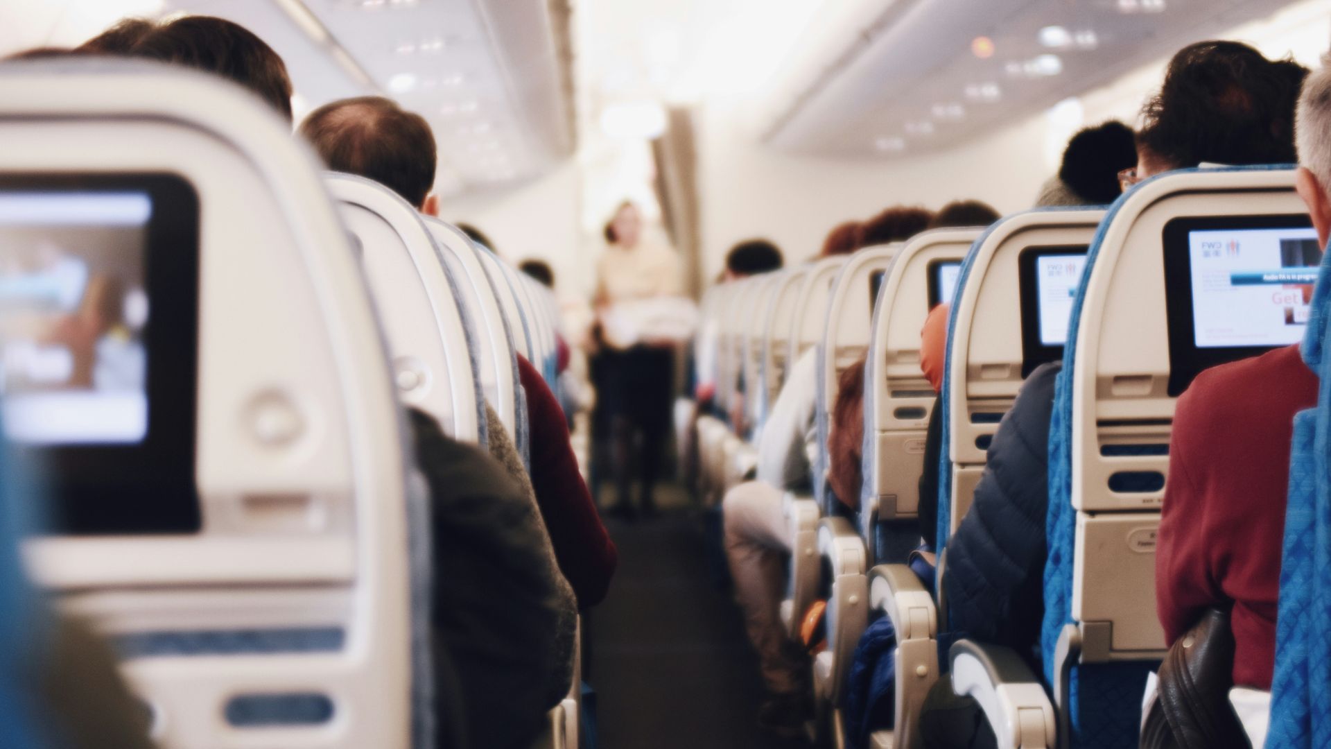 shallow focus photography of people inside of passenger plane