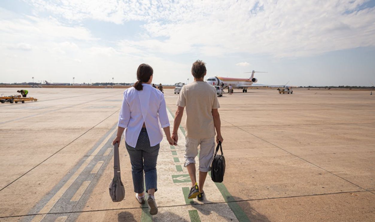 Couple Walking in the Airport