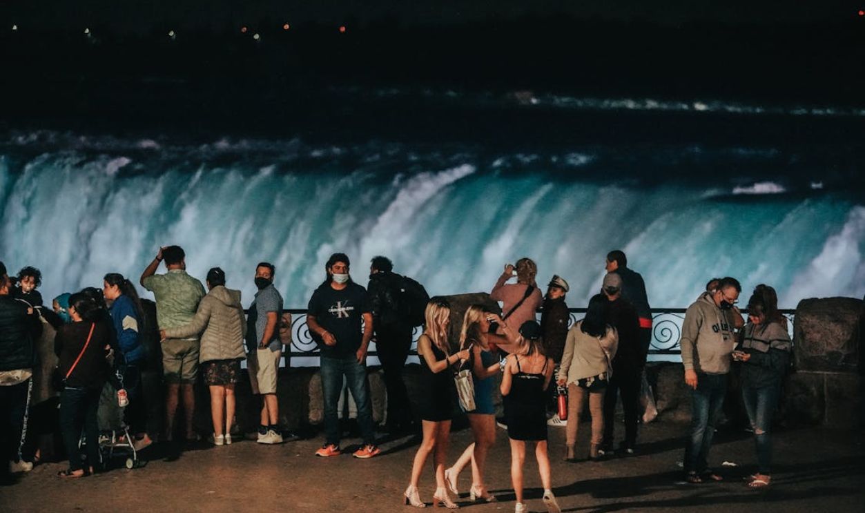 People Standing Near the Waterfalls