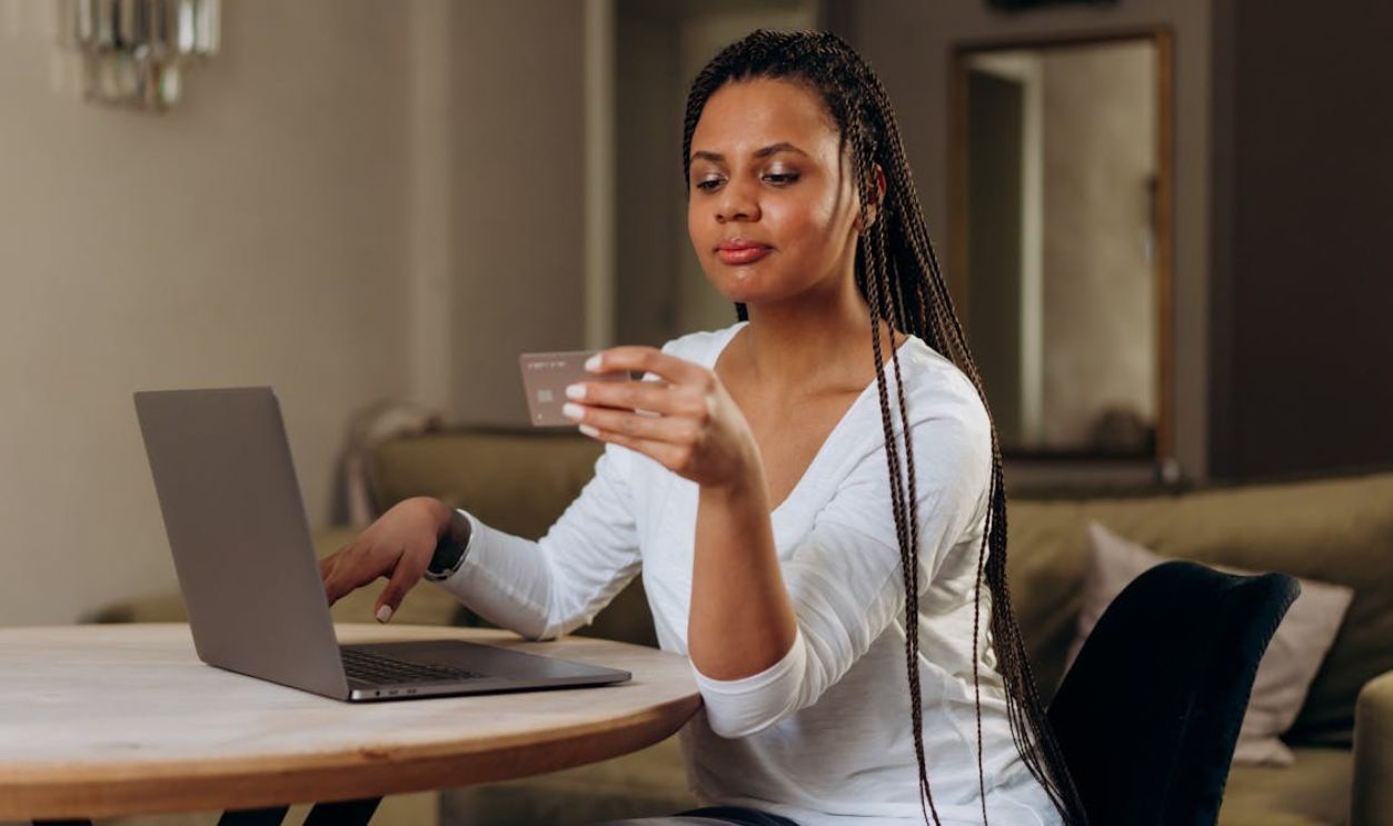 A Woman Using Her Credit Card Online
