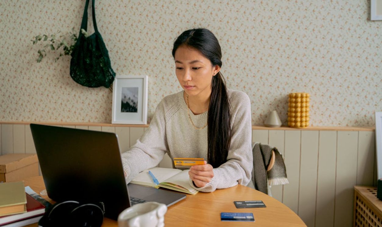 Woman in Gray Sweater Online Shopping
