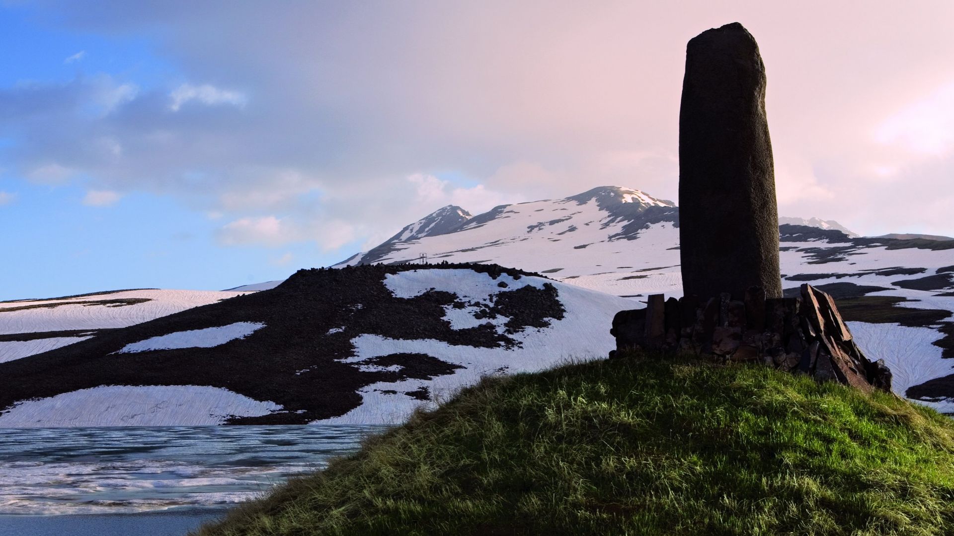 Vishap against the Background of Snow-Capped Mt Aragats
