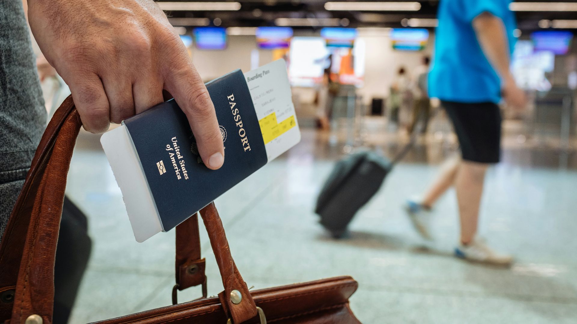 a hand holding a book
