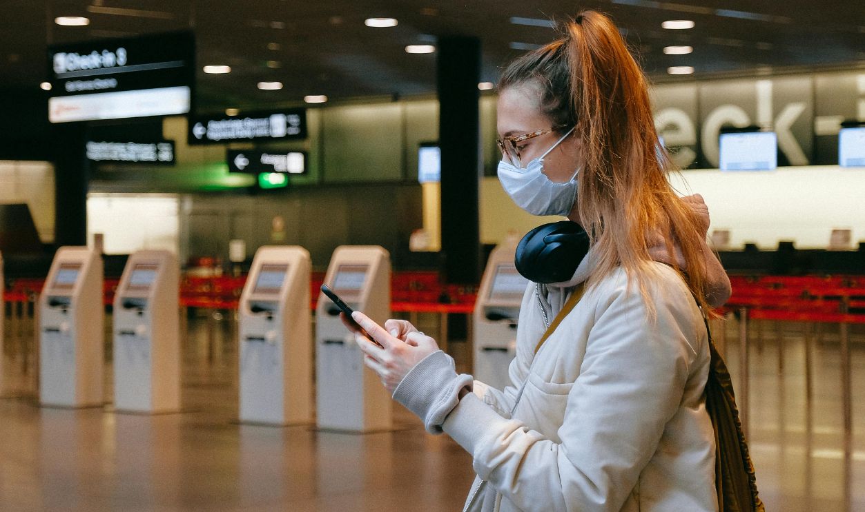 Woman With a Face Mask Texting