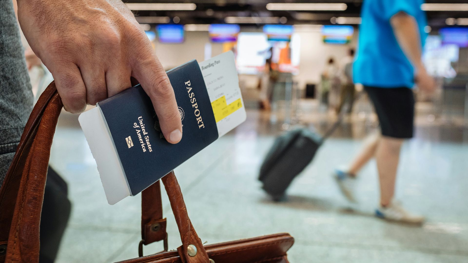 a hand holding a book