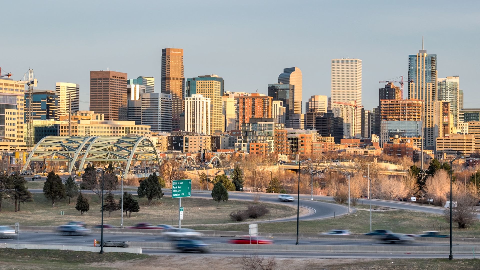 500px provided description: Denver skyline at sunset. While I was shooting a news crew set up next to me for their evening remote, I guess it's a popular spot.  Ended up being a two exposure composite. [#city ,#sunset ,#street ,#cars ,#highway ,#bridge ,#building ,#skyline ,#Colorado ,#Denver]