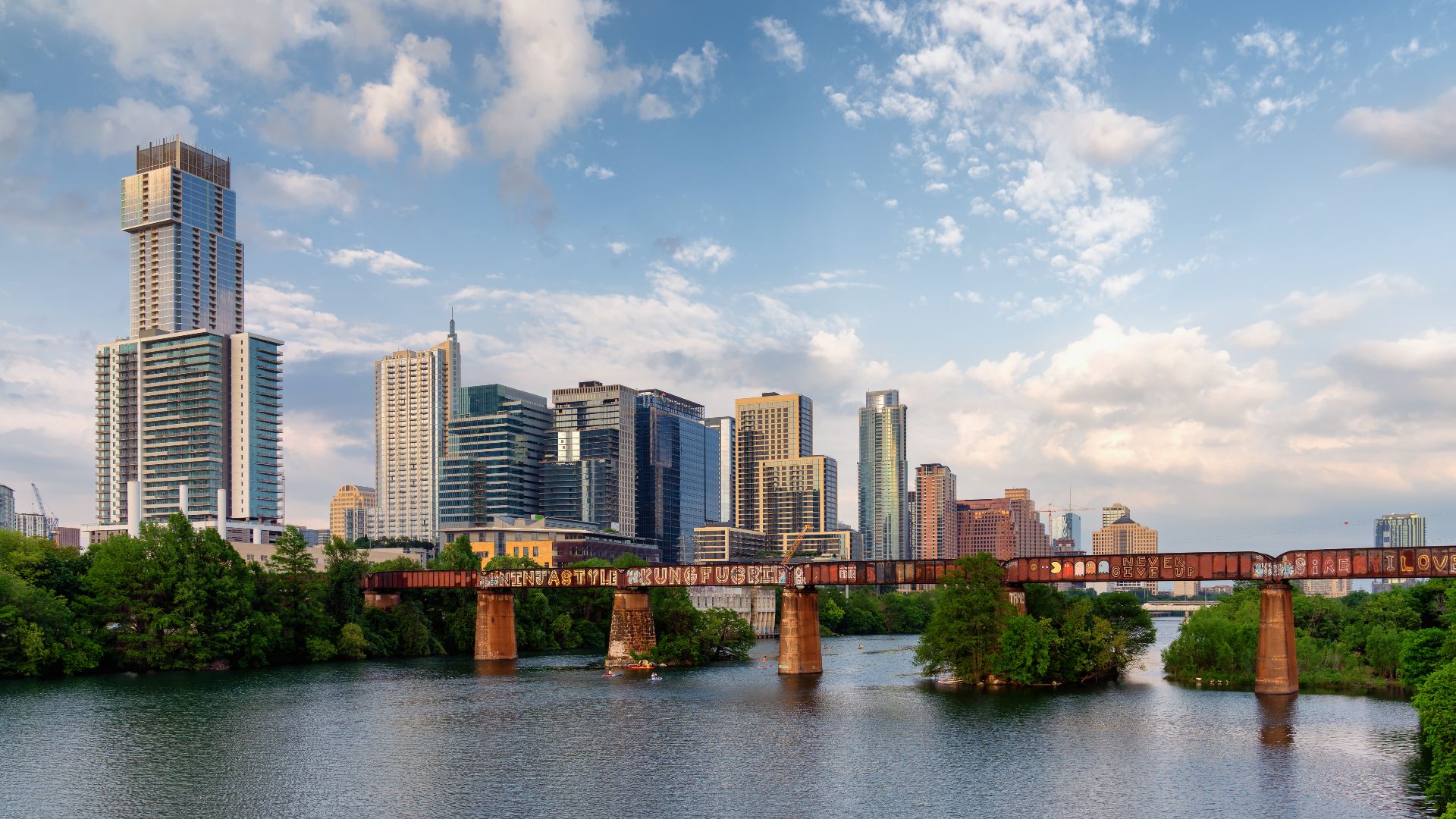 The skyline of Austin, Texas, as seen from a pedestrian bridge over the Colorado River.

© 2019 Tony Webster.