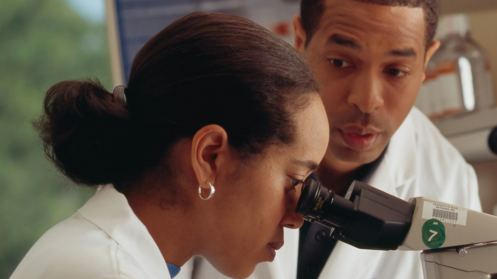 man in white chef uniform holding black and silver power tool