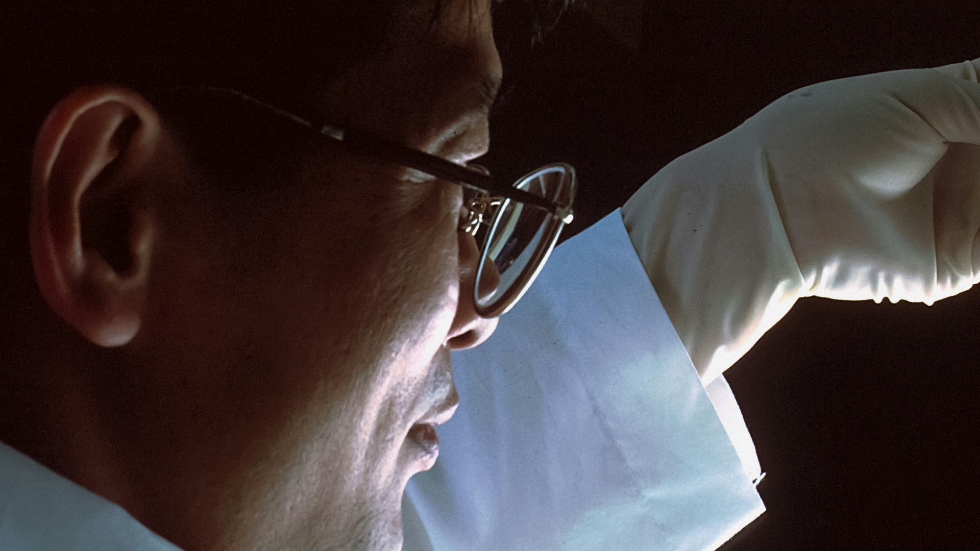 person in brown long sleeve shirt wearing silver framed eyeglasses