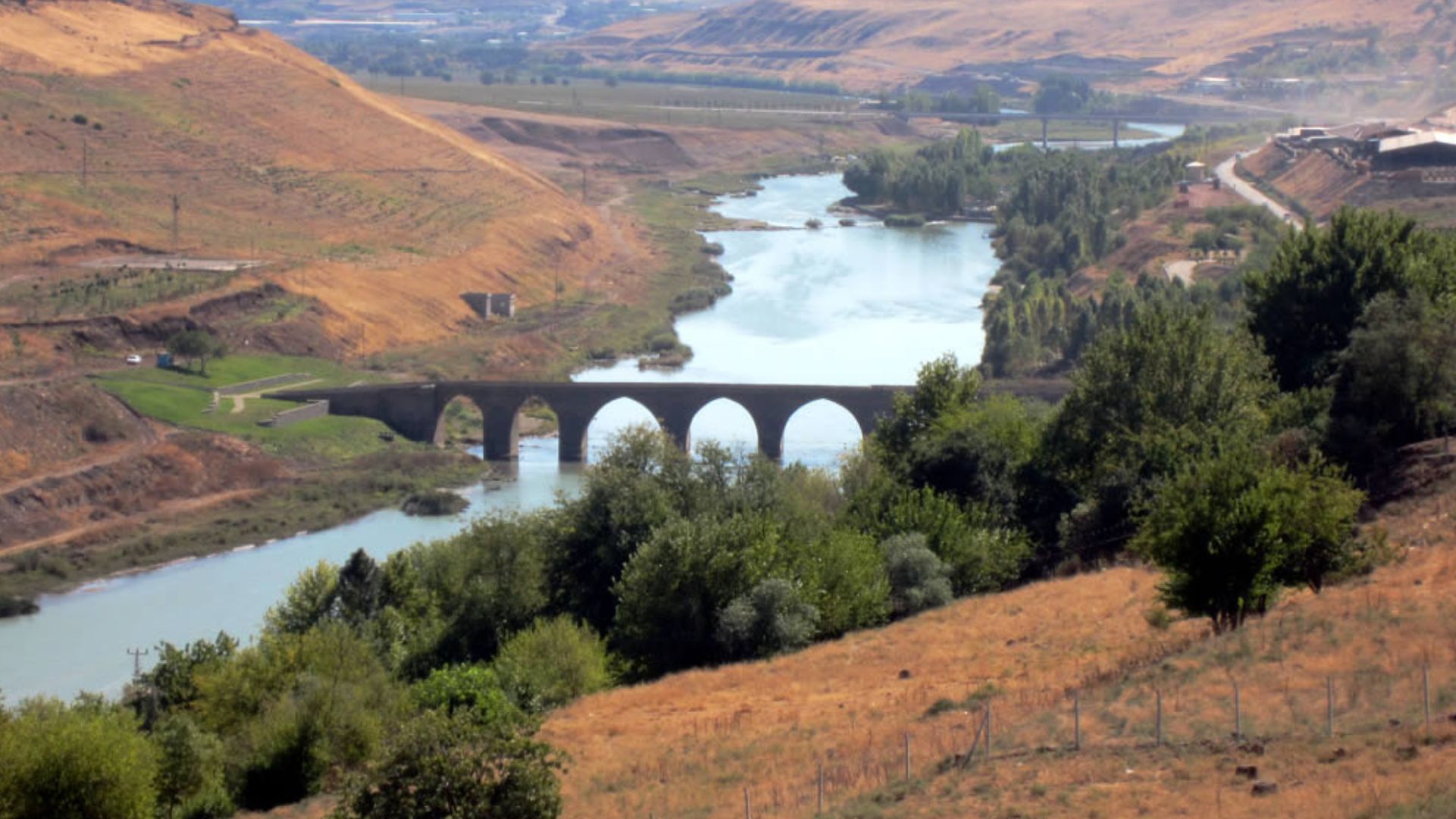 The Tigris River passes east of Diyarbakir and flows below the 11th century Ten-Eyed Bridge before turning southeast toward Baghdad.