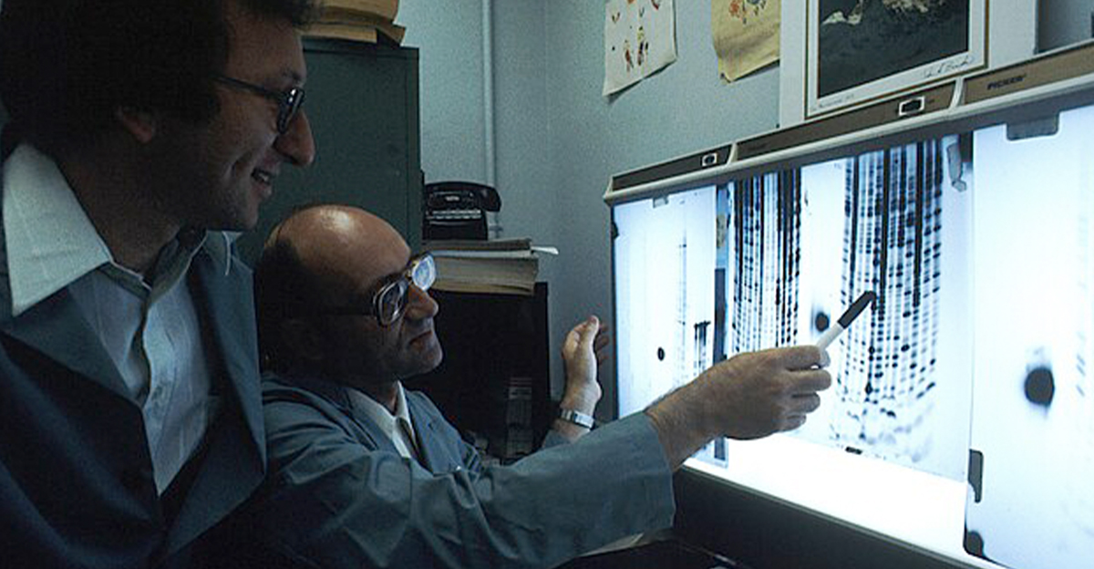 Two scientists looking at DNA sequencing