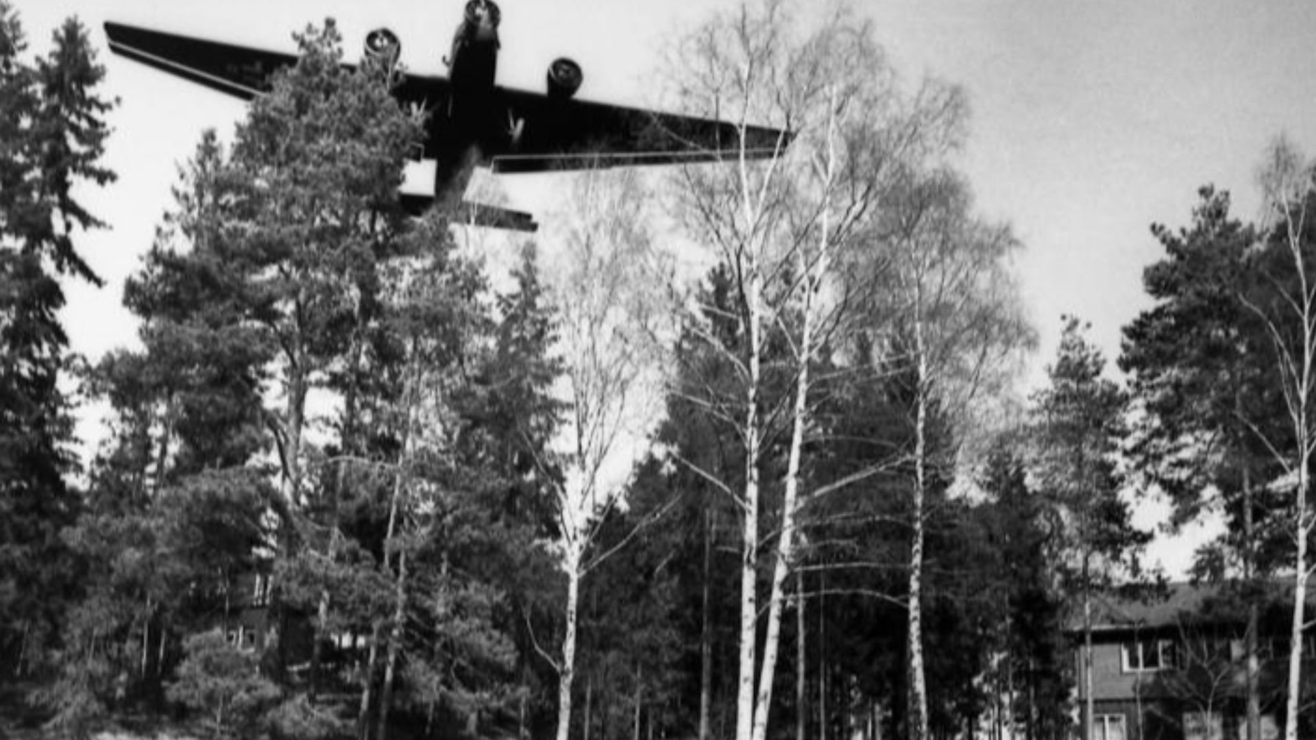 Messerschmitt Bf 110 of future night fighter ace Lt. Helmut Lent overshoot the runway in Oslo-Fornebu and came to rest in the garden of a house. A Junkers Ju 52/3m plane flies over the location. The photo has been taken by war reporters of the 5th Luftwaffe in Oslo1940.