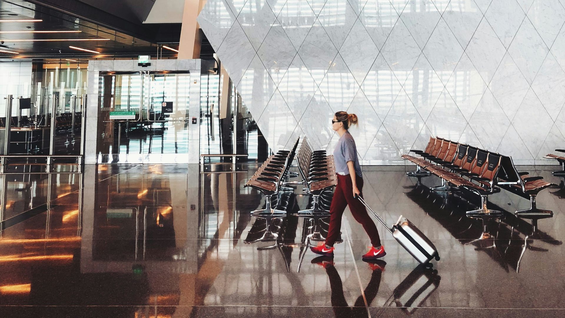 person walking inside aiport