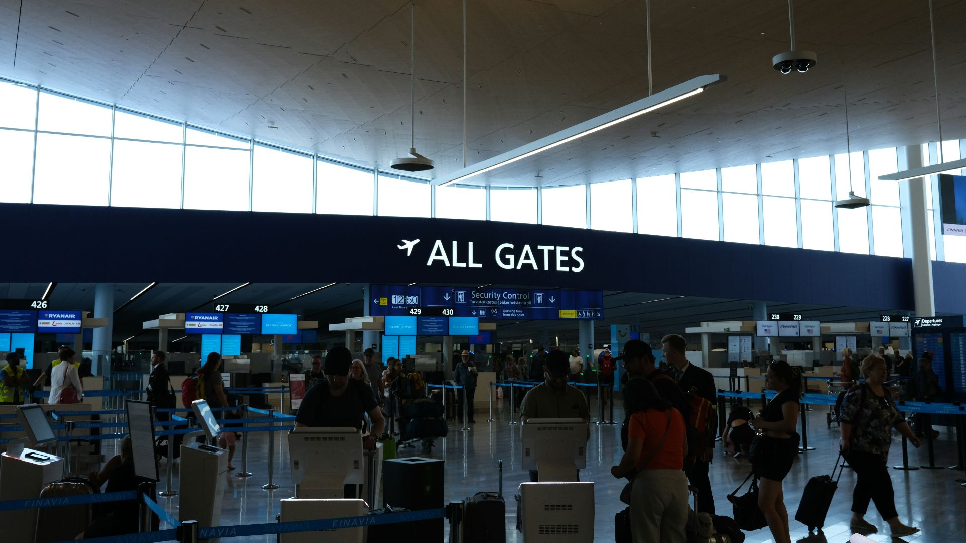 a group of people walking through an airport