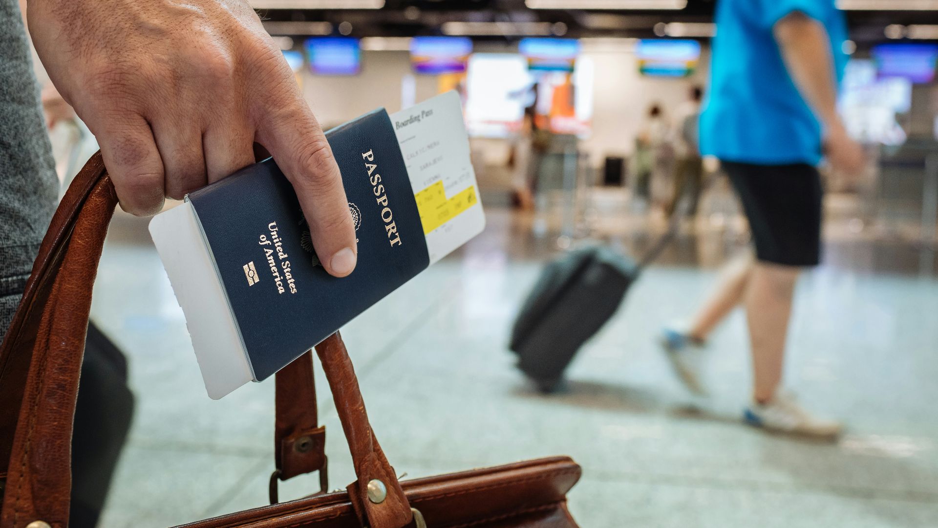 a hand holding a book