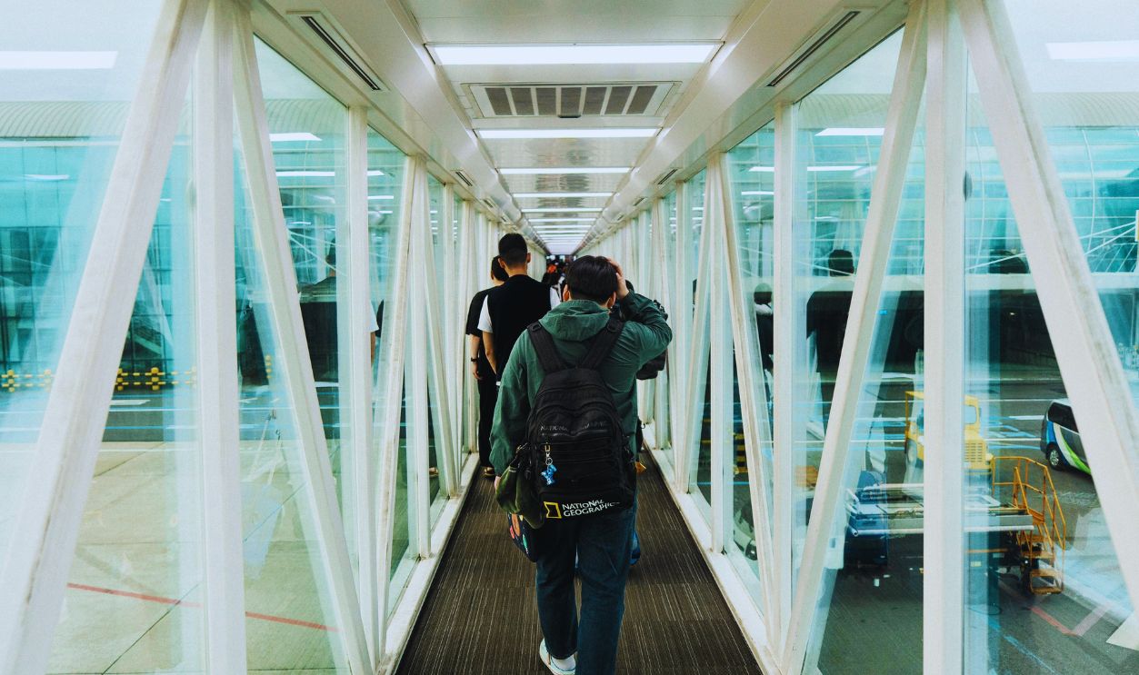Men in a Tunnel at the Airport