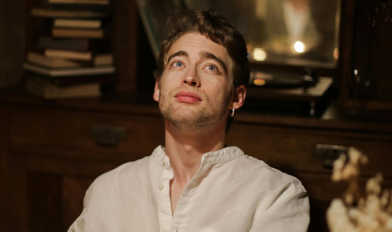 Man in White Dress Shirt Standing Near Brown Wooden Wall