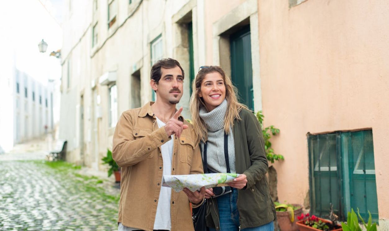 Man and Woman Standing on the Street