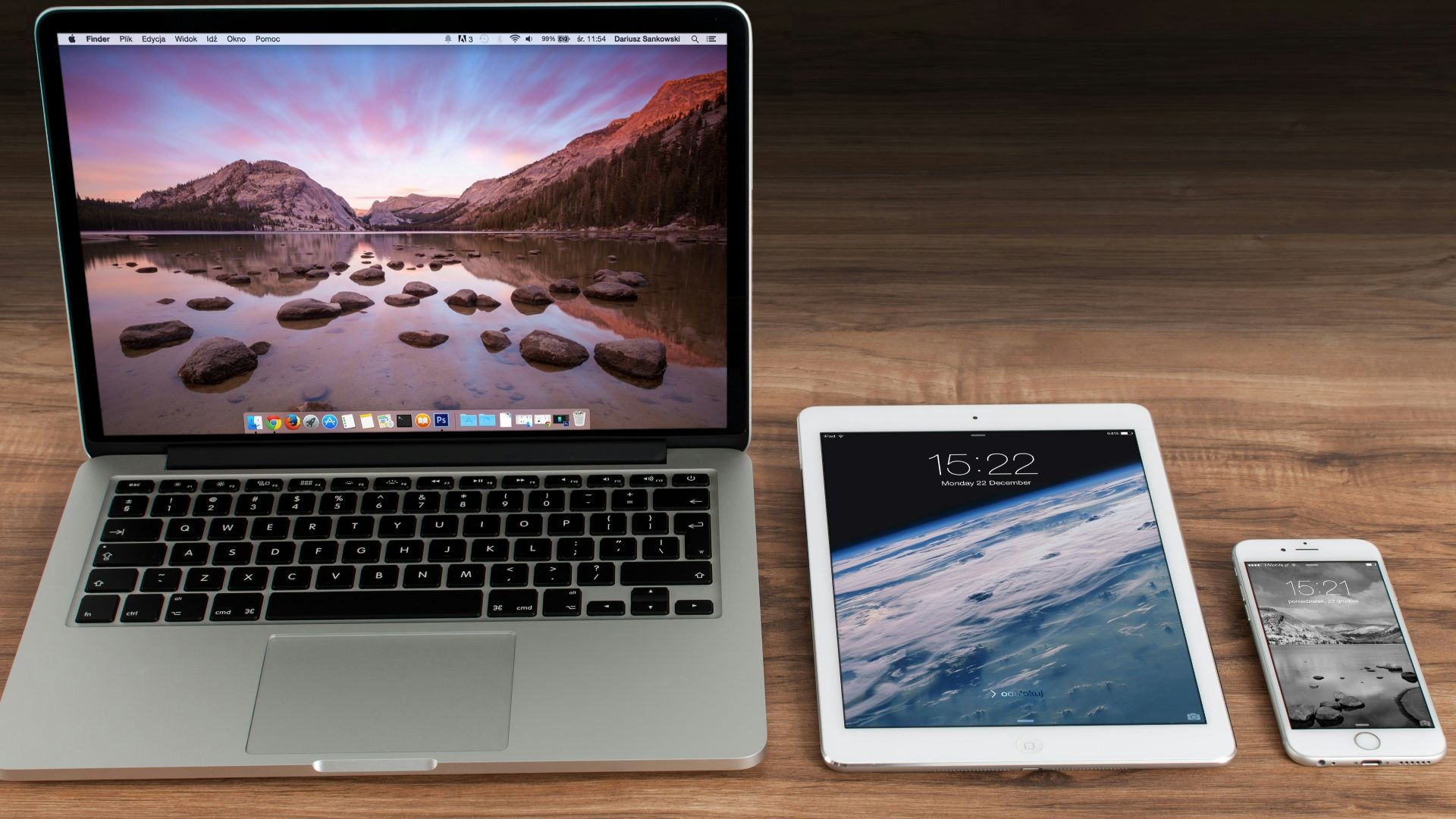 MacBook Pro beside iPad and iPhone turned on