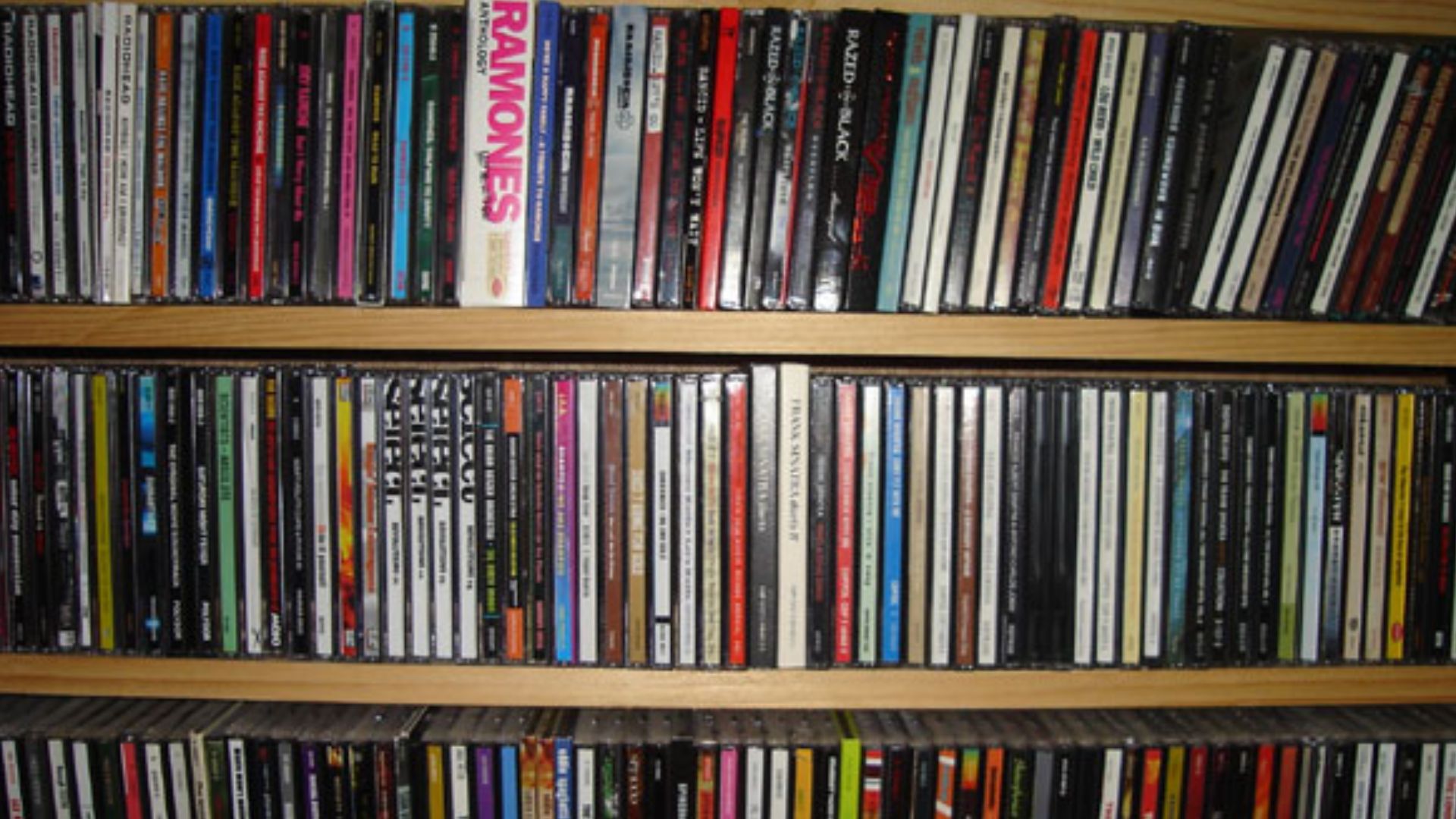 CD collection. Original text: Here are some of our thousands of cds.  My Dad made these bookcase-type cd cases for us before he passed away.  They are great, as is everything my Dad made!
