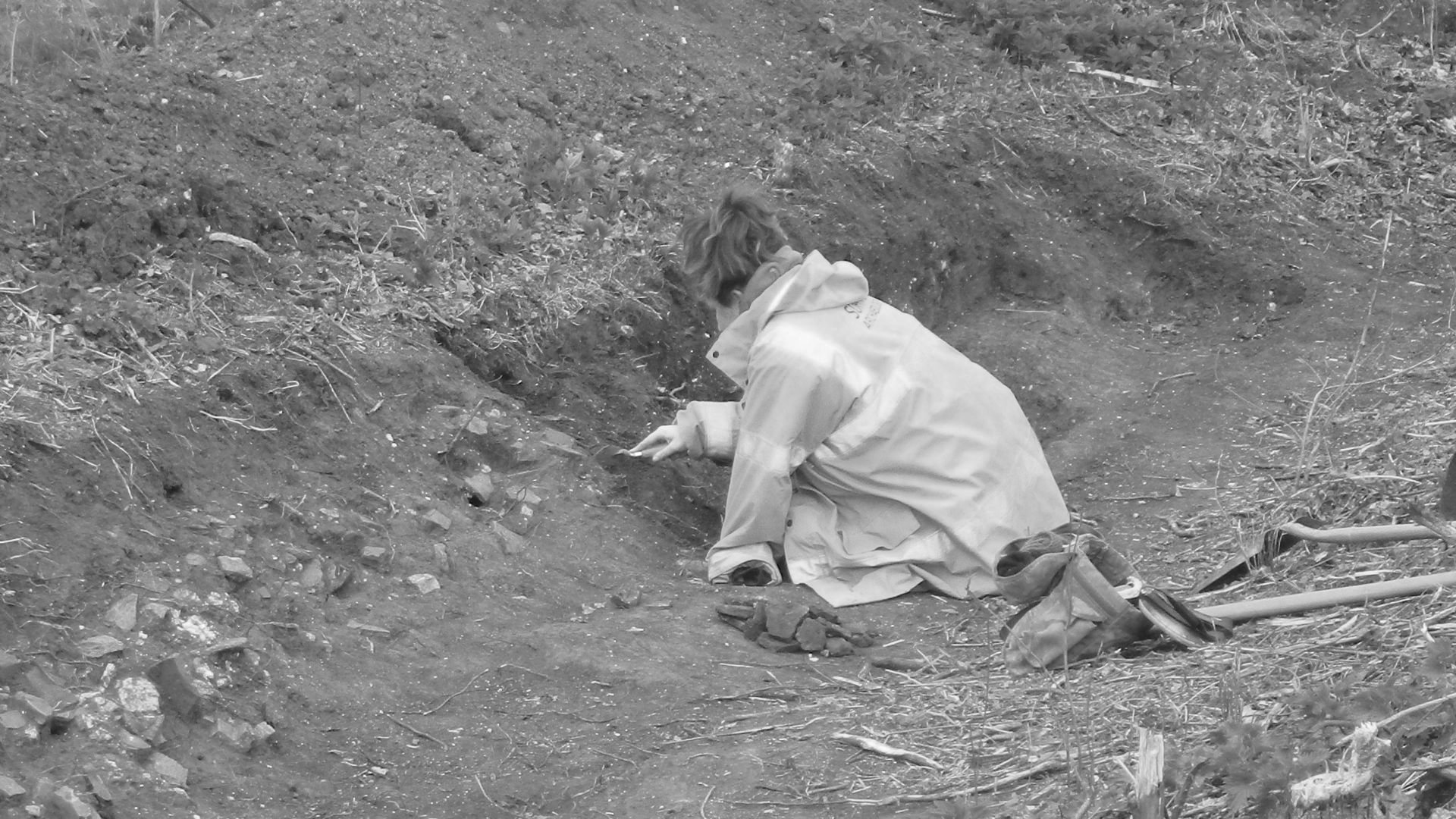 Archaeologist excavating at the Roman Barrow Group and Villa, Rougham, Suffolk, March to December 2017